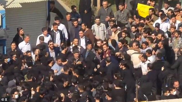 Clashes erupt at mass student demonstrations in Iran - as Trump ramps up US presence