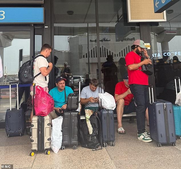 Rush to escape Dubai by bus, taxi and jet: Chaos and gruelling 16-hour journeys across the desert - while the wealthy fight for spots on £143k private jet flights