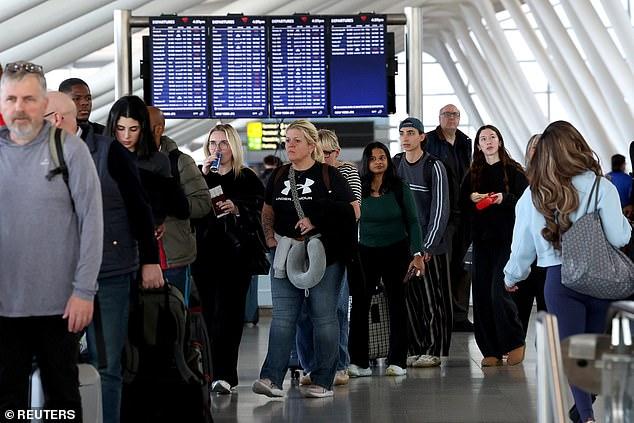 TSA lines as horrific as ever despite vote to pay security agents - as experts warn it could be WEEKS before wait times return to normal