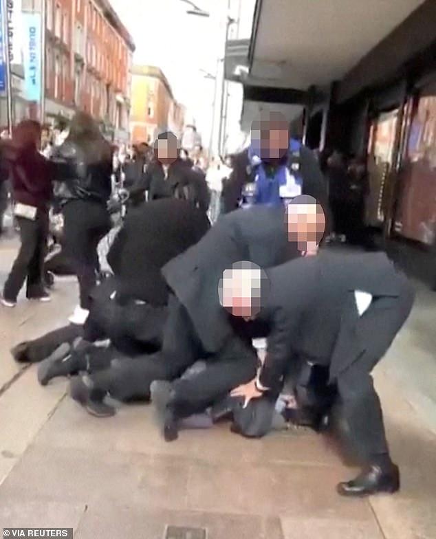 'Ireland's George Floyd moment': Hundreds of protesters gather in Dublin amid mounting fury over death of Congolese 'shoplifter' after he was pinned down by security guards