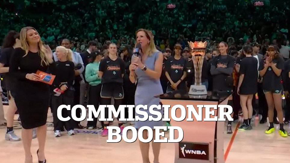 WNBA boss gets relentlessly booed amid Caitlin Clark uproar... after cozying up to Tom Brady for photo-op