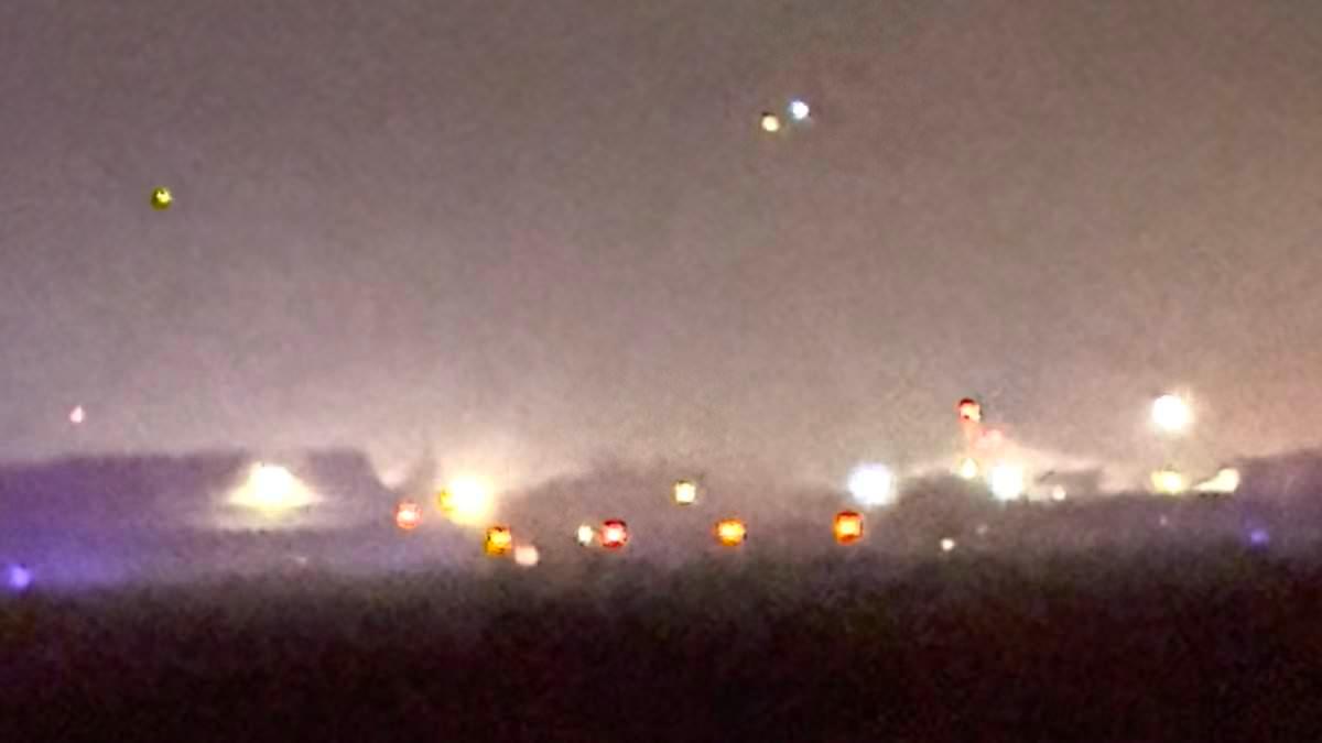 Police helicopter pilot 'thought he might die' in near-miss over US airbase as he hunted drones launched from Russian ship