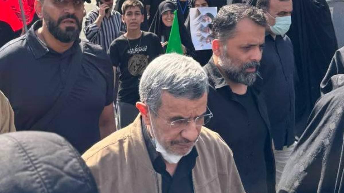 Iran's ex president Ahmadinejad 'comes back from the dead' as he is seen at Supreme Leader's funeral - weeks after state-media announced his death in US war