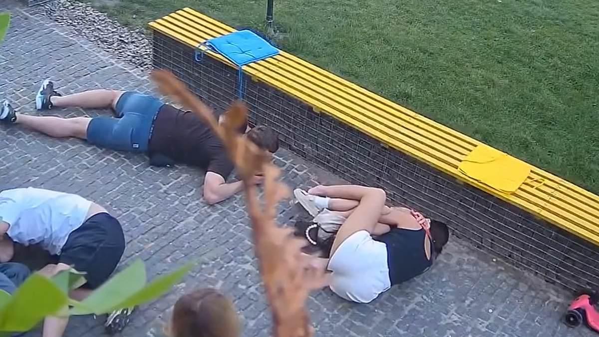 Terrifying moment people hurl themselves to ground when Russian strike lands near Ukraine coffee shop - as four killed in overnight attack