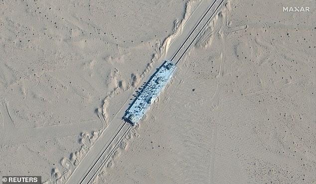 China's secret blueprint to bomb US warships: Satellite images show huge replicas of American destroyer and carrier built for missile practice in remote desert