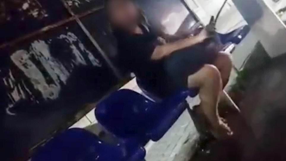 Moment Iranian morality police force woman to cover her bare legs with trousers as new hijab crackdown sees dozens of cafes and gyms sealed off