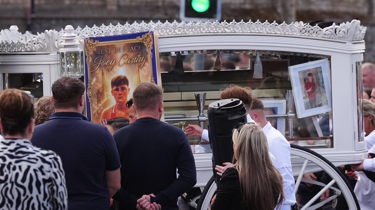 Funeral is held for one of five teenage boys who died in head-on crash when they drove car wrong-way on Irish motorway - as police surround church amid fears of disorder