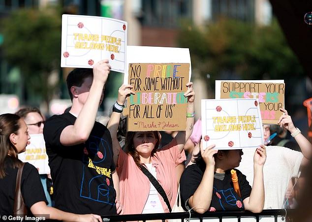 Protestors clash in heated scenes ahead of Fever's clash against Liberty as pro-trans campaigners hit out at 'grotesque' Sophie Cunningham amid WNBA storm