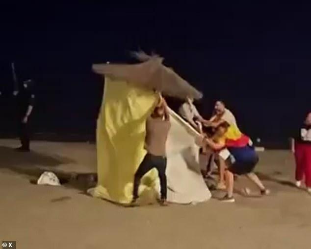Locals fighting to remove thousands of migrants who remain in Ceuta following 'invasion' destroy makeshift camp as fears grow over groups of men roaming the streets