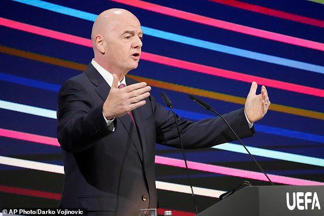 Furious soccer fans unveil Times Square billboard calling for Gianni Infantino to be ousted as they accuse embattled FIFA President of blackmail