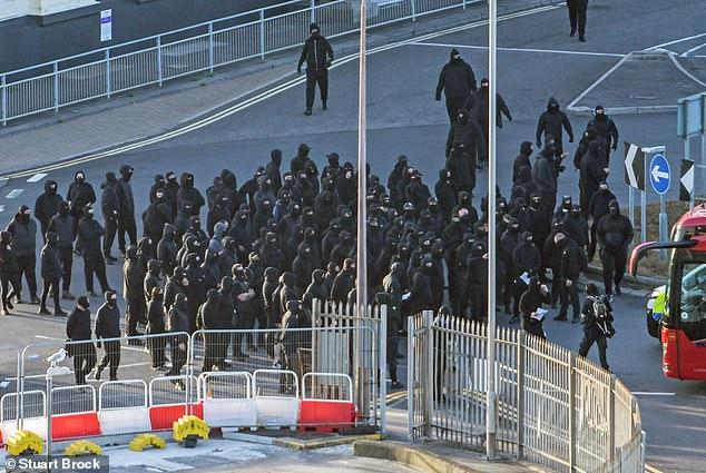 Anger as balaclava-clad mob bring Dover to a halt in 'stop the boats' protest with four-mile tailbacks leaving town gridlocked as hundreds miss ferries