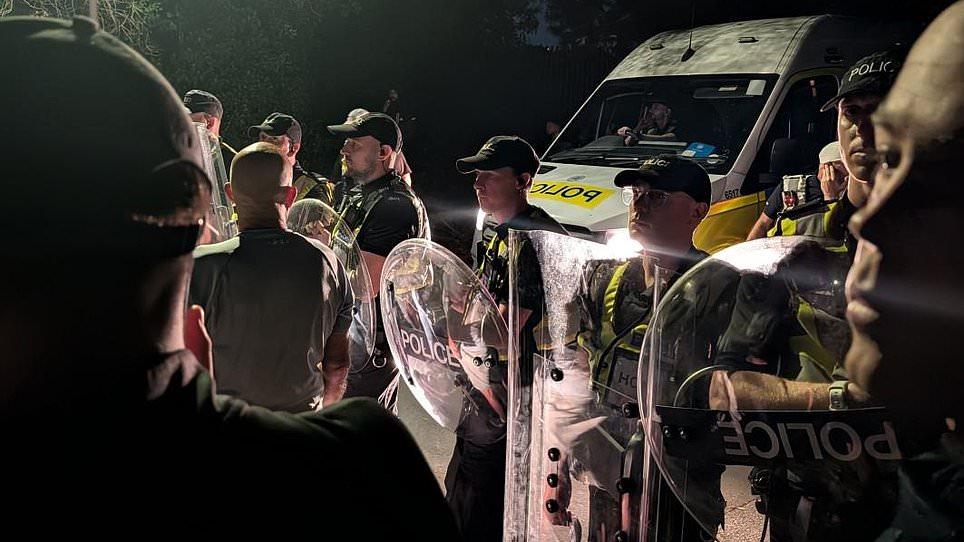 Chaotic scenes as hundreds of anti-migrant protesters descend on Portsmouth and clash with riot police after some 140 asylum seekers are rescued from 'mega-dinghy' and brought ashore