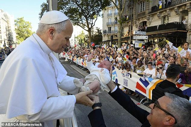 Pope Leo's mass appeal: American pontiff is met by 600,000 crowd as he arrives for outdoor service in Paris before heading for Lourdes