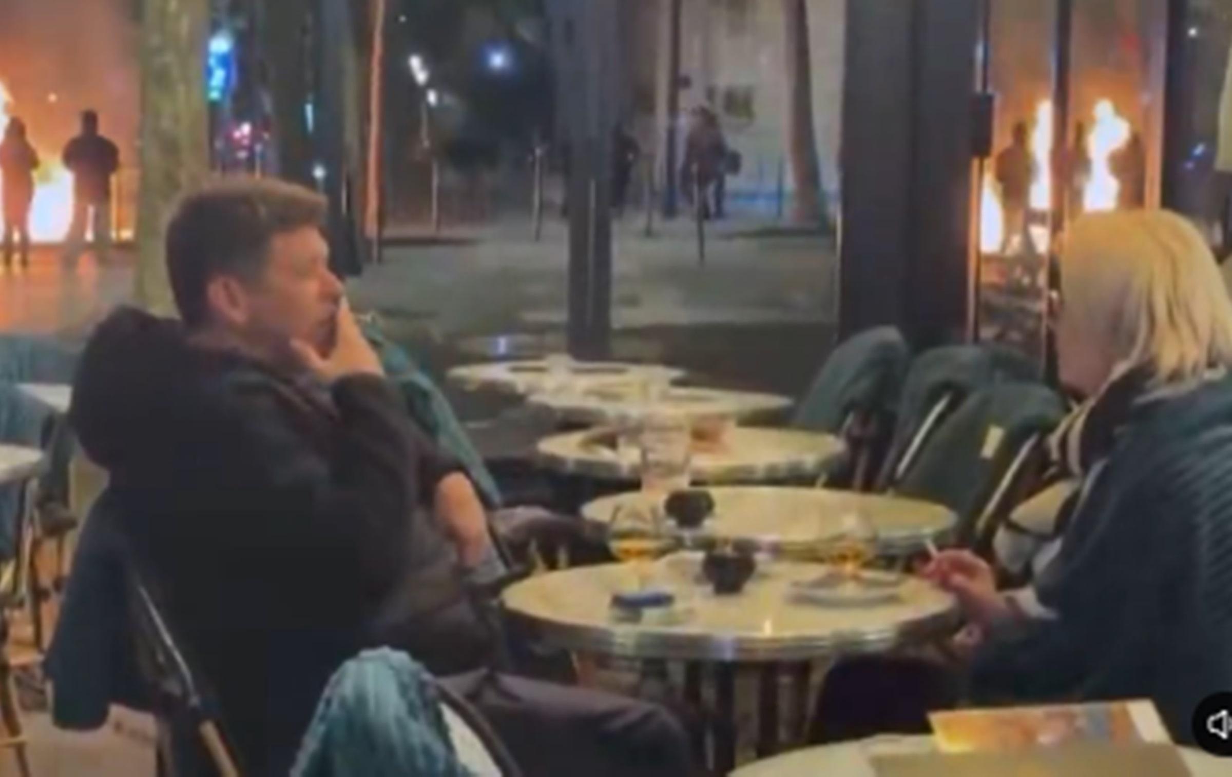 We will always have Paris: couple drinks and chats in a bar amid protests