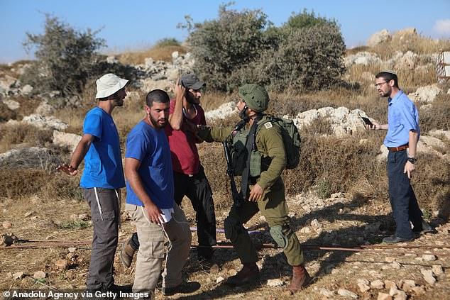 Miliband is set to ban trade with settlements in the West Bank: Israel retaliates by demanding UK stop 'occupying' Falklands amid warnings Labour's move will damage UK's security