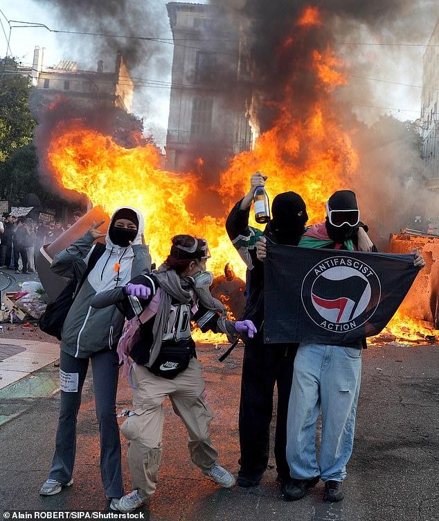 Trump blames mass migration for French riots... as Macron vows looters and agitators will pay for seeking 'to bring down the Republic'