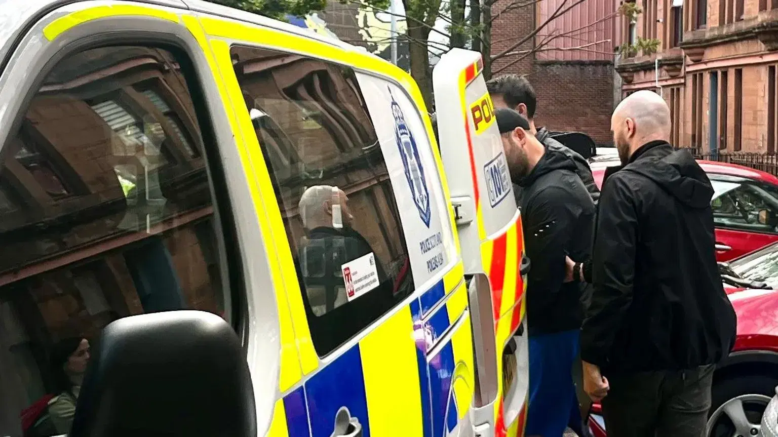 Man, 29, charged after police raid over racist traffic-cone attack