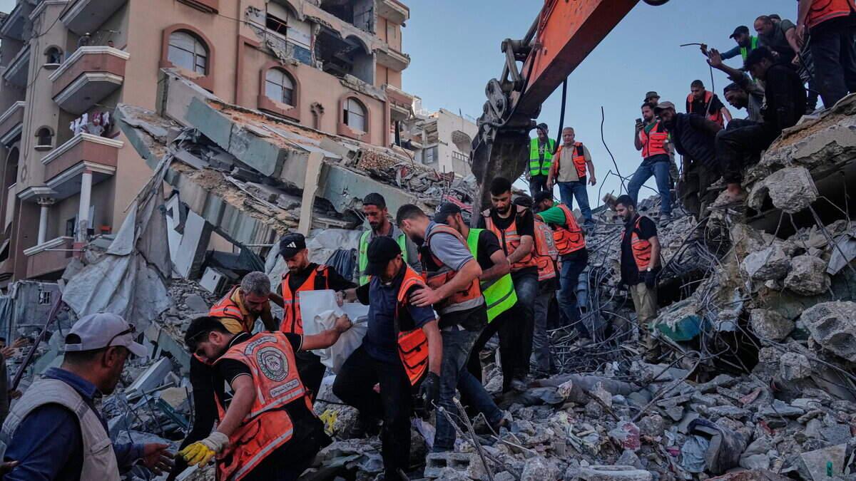 At least 20 die as bombed-out building in Gaza collapses on families taking shelter