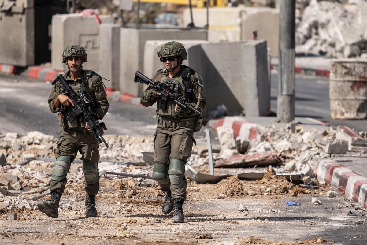 Israel expels hundreds of families from their homes in the West Bank after shooting kills two soldiers