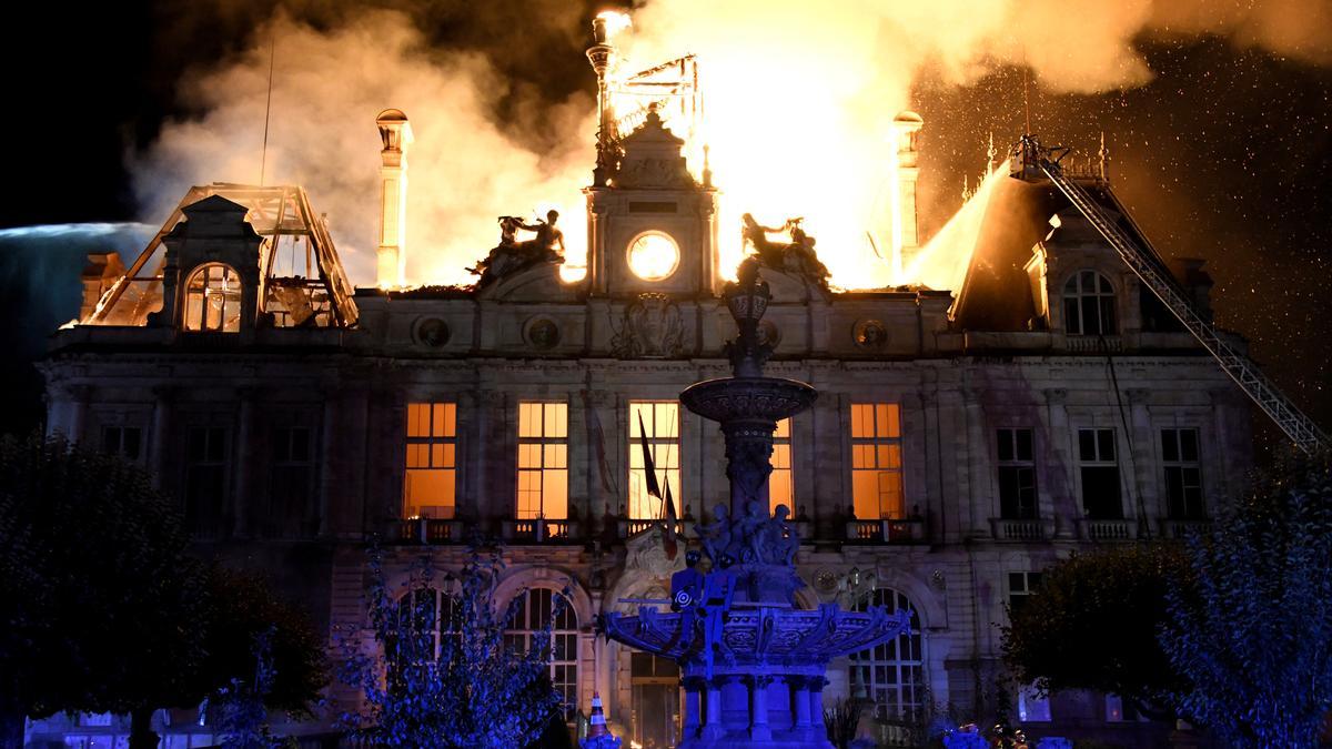 France arrests man, calls in anti-terror police over town hall protest fire